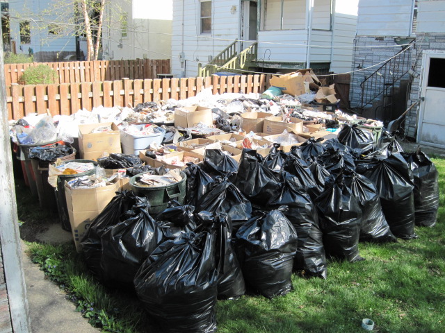 How can a junk removal company save me time and money when clearing my backyard junk?